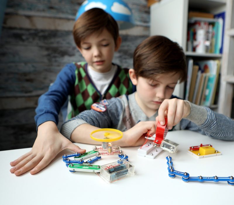 boy 9 and 7 years old make scientific experiments with the constructor boy 9 and 7 years old make scientific experiments with the constructor